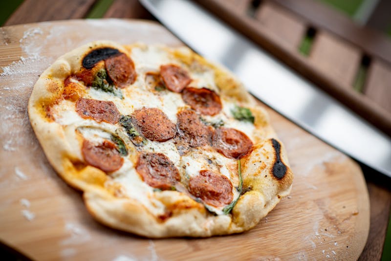 Pizza luce served at the table