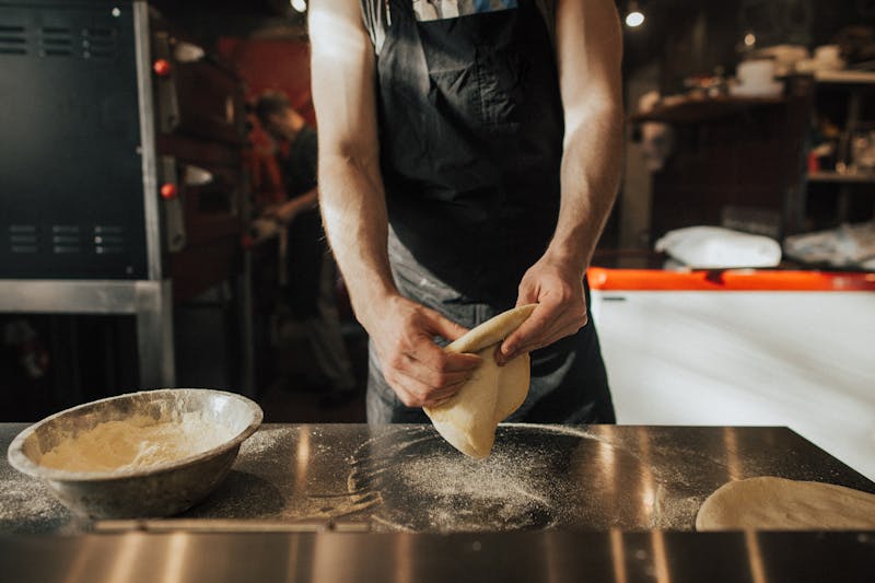 Handcrafted pizza luce being prepared in the kitchen